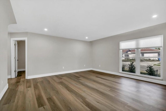 empty room featuring dark hardwood / wood-style floors