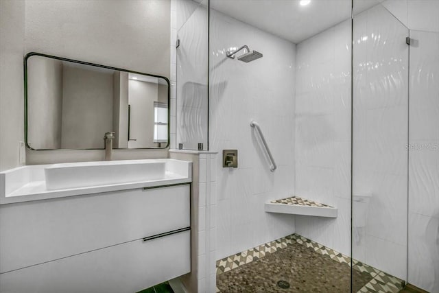 bathroom featuring vanity and a tile shower