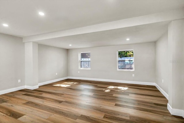 spare room with hardwood / wood-style floors