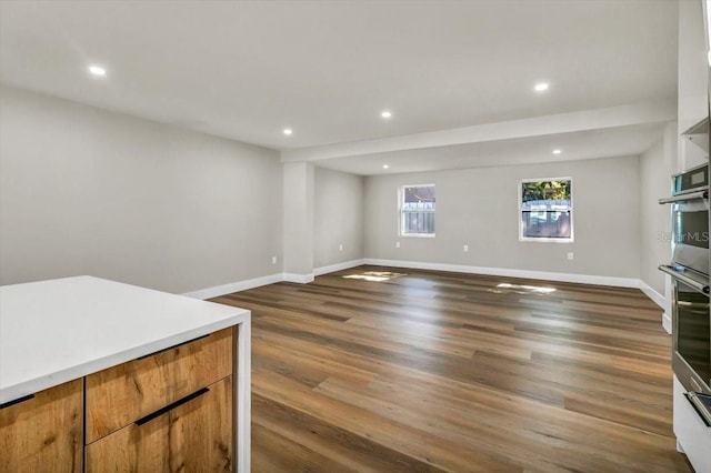 living room with dark hardwood / wood-style flooring