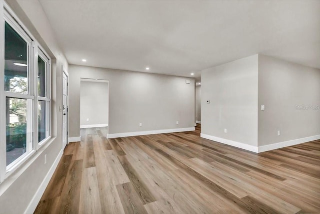 unfurnished room with light hardwood / wood-style flooring