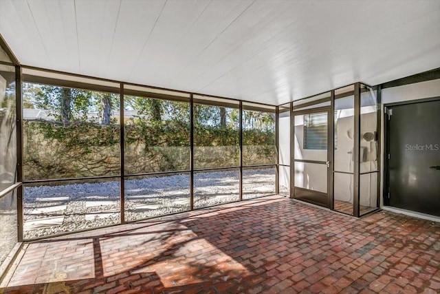 unfurnished sunroom with a wealth of natural light