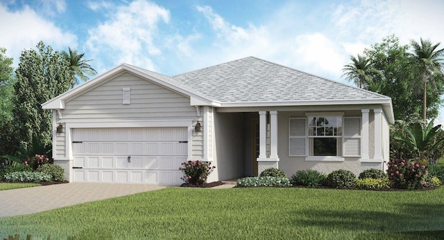 view of front of home with a garage and a front lawn