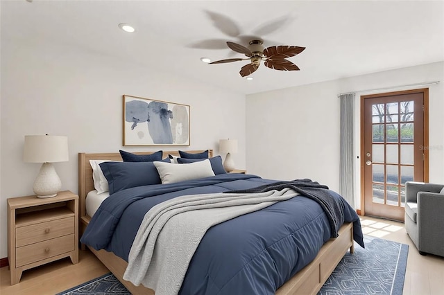 bedroom with ceiling fan, light hardwood / wood-style flooring, and access to outside