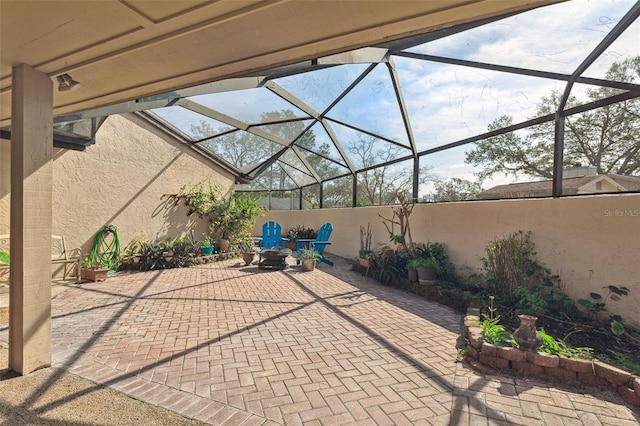 view of patio / terrace with glass enclosure