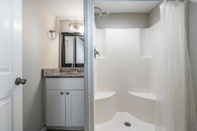 bathroom with vanity and curtained shower