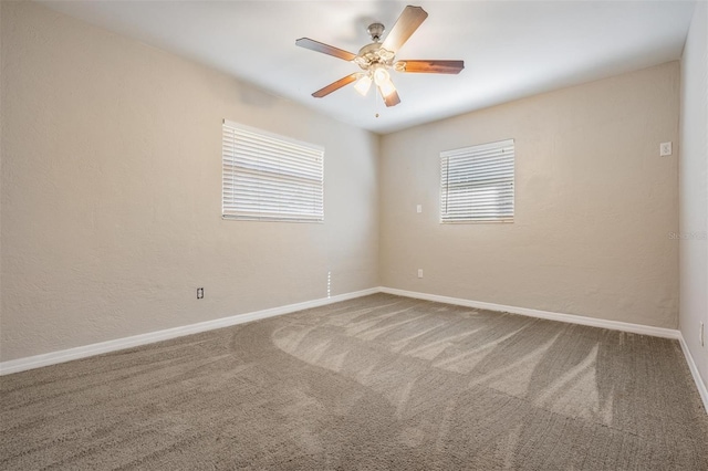 unfurnished room with carpet floors and ceiling fan