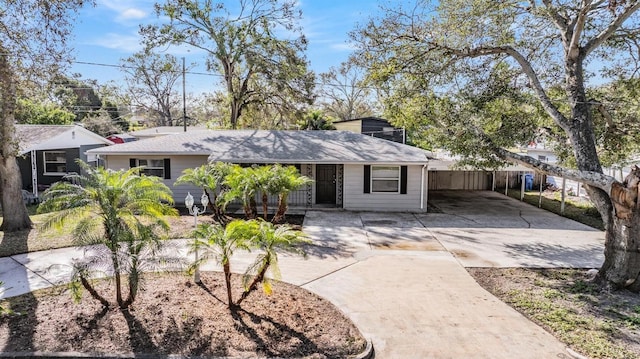 ranch-style home featuring a carport