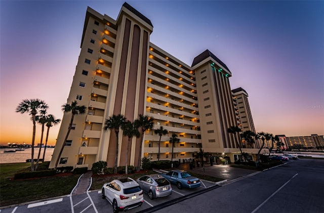 outdoor building at dusk featuring a water view