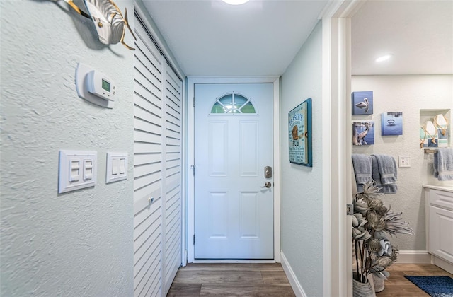 entryway with dark hardwood / wood-style floors