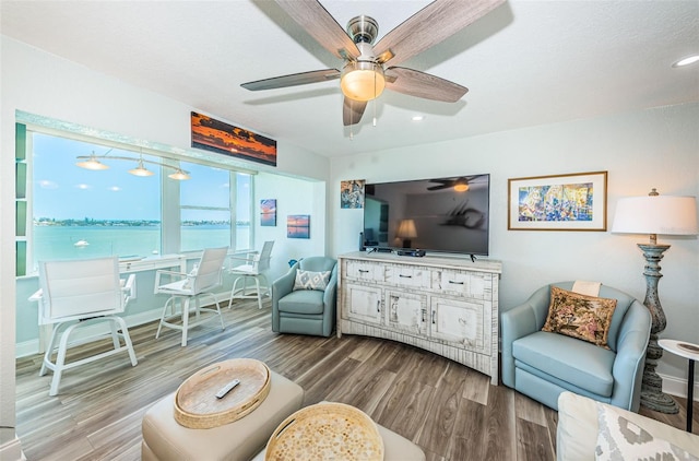 interior space featuring hardwood / wood-style flooring and ceiling fan