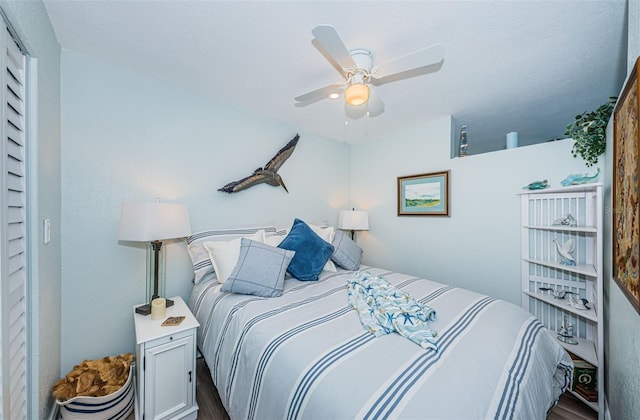 bedroom featuring wood-type flooring and ceiling fan