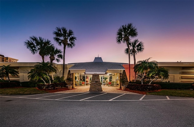 view of outdoor building at dusk