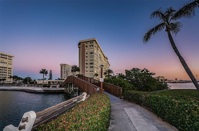 outdoor building at dusk featuring a water view