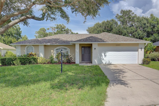 ranch-style house featuring a garage and a front lawn