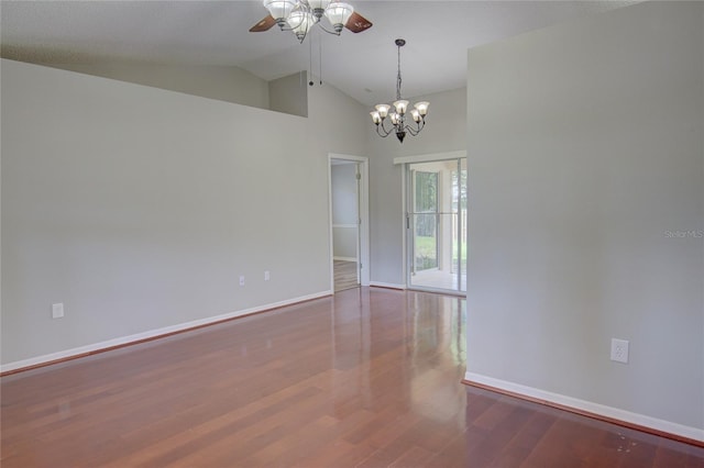 unfurnished room featuring ceiling fan with notable chandelier, wood-type flooring, and vaulted ceiling