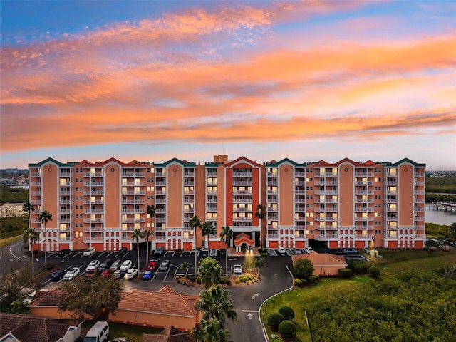 view of outdoor building at dusk