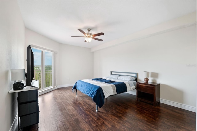 bedroom with ceiling fan and dark hardwood / wood-style floors