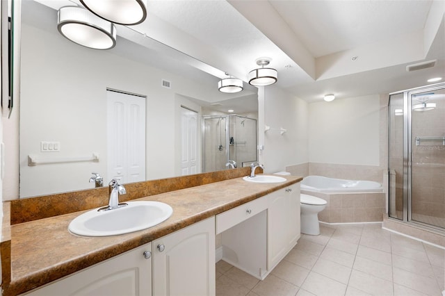 full bathroom featuring independent shower and bath, vanity, tile patterned floors, and toilet