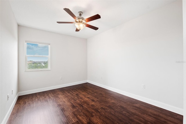 empty room featuring ceiling fan and dark hardwood / wood-style flooring