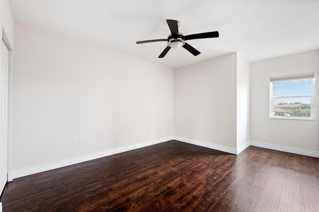 unfurnished room with ceiling fan and dark hardwood / wood-style floors