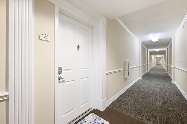 4516 Seagull Dr Unit 303, New Port Richey, FL 34652 - hallway featuring dark colored carpet and crown molding