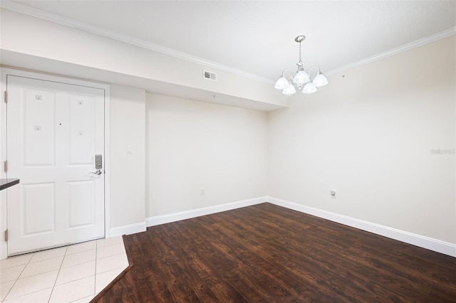4516 Seagull Dr Unit 303, New Port Richey, FL 34652 - below grade area with wood finished floors, a chandelier, and crown molding