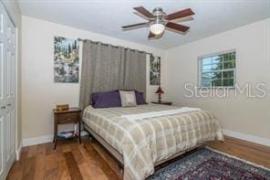 bedroom with ceiling fan and hardwood / wood-style floors