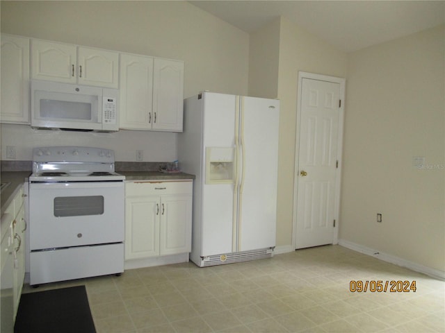 kitchen with white cabinetry and white appliances