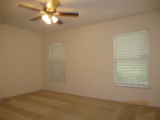 unfurnished room featuring ceiling fan