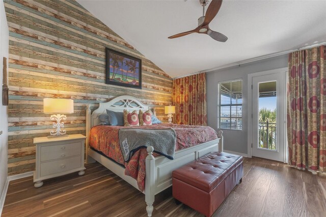 bedroom with access to exterior, dark wood-type flooring, vaulted ceiling, and ceiling fan