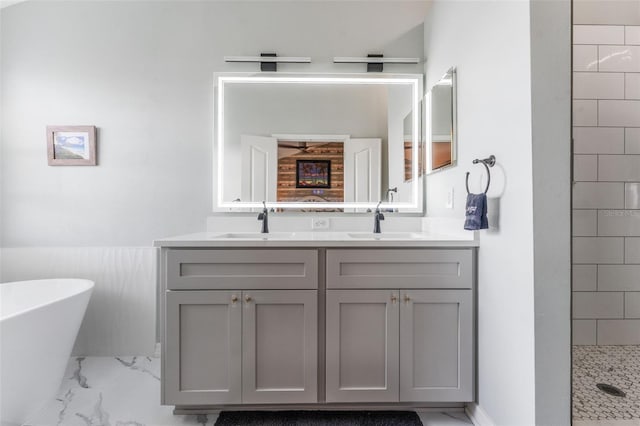 bathroom with vanity and separate shower and tub