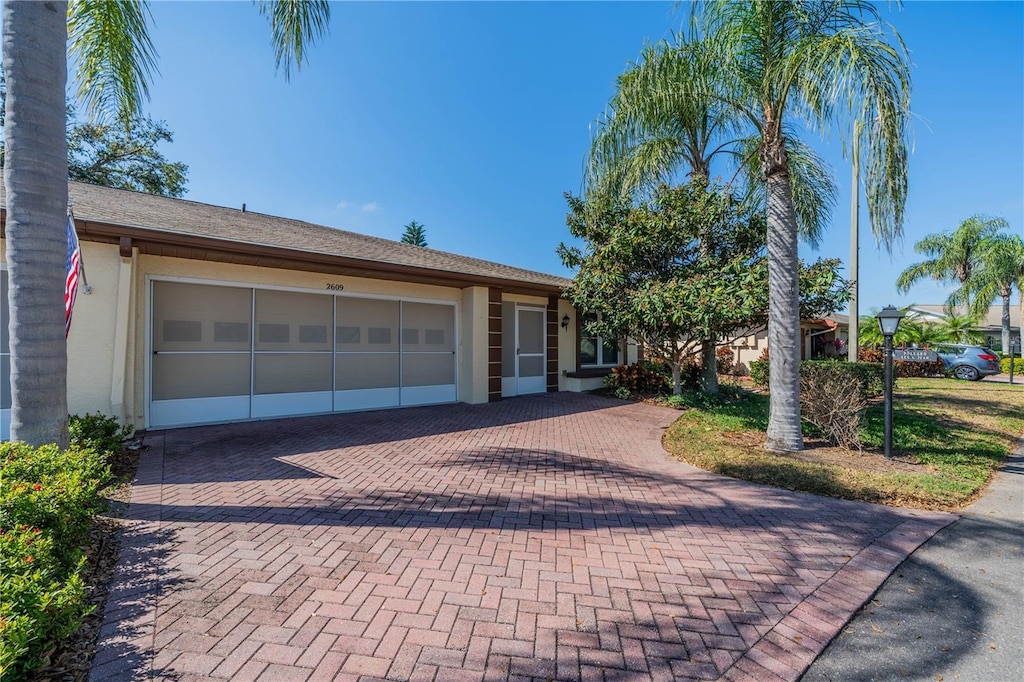 ranch-style house featuring a garage