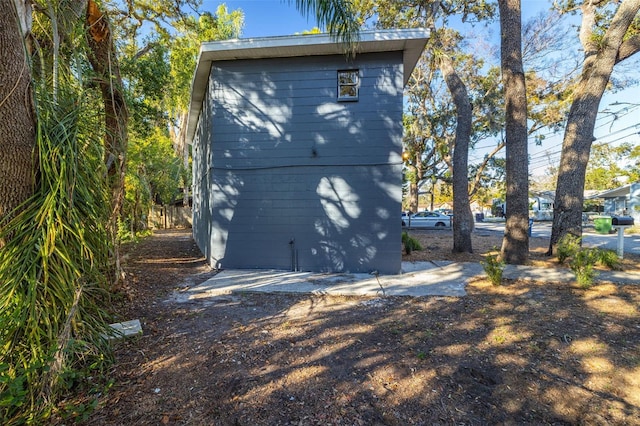 view of home's exterior featuring a shed