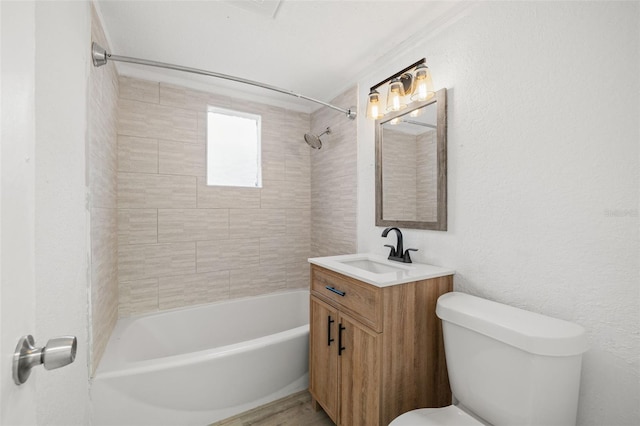 full bathroom with tiled shower / bath combo, vanity, and toilet