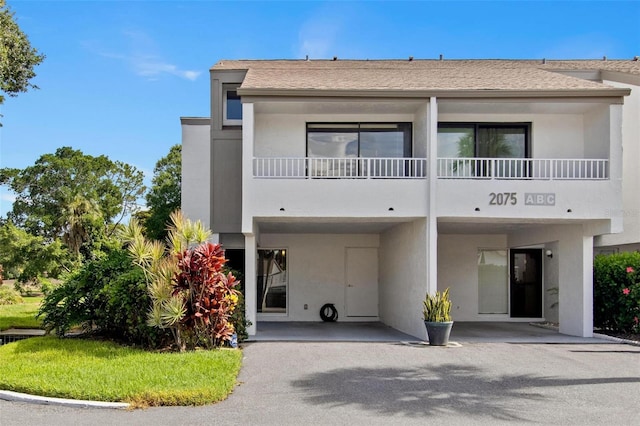 view of front of home with a carport