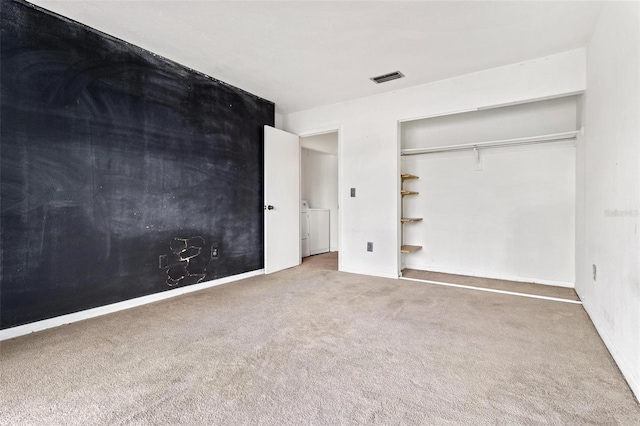 unfurnished bedroom featuring a closet and carpet