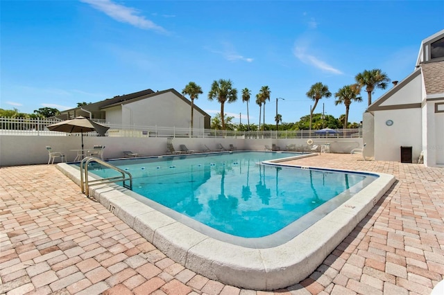 view of swimming pool with a patio area