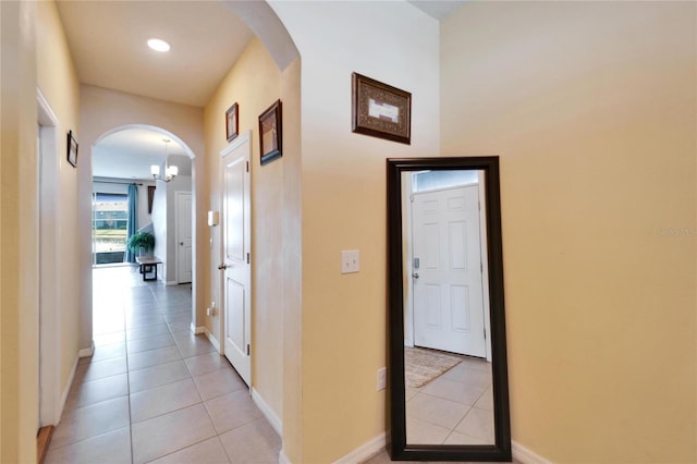 corridor with light tile patterned floors