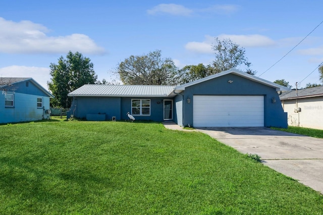 ranch-style house featuring a garage and a front yard