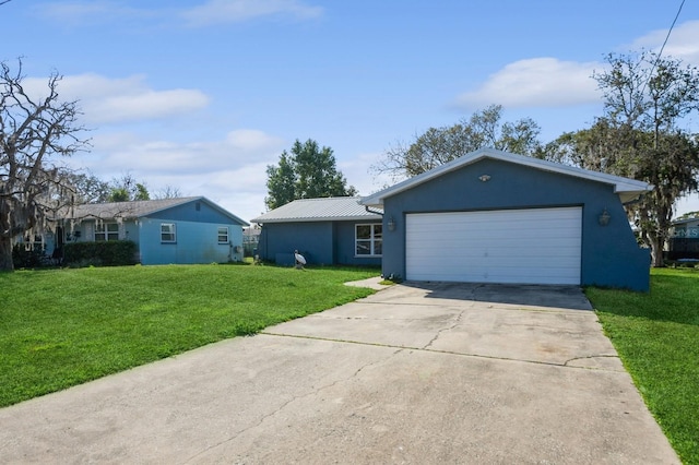 ranch-style house featuring a garage and a front lawn