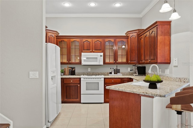 kitchen featuring pendant lighting, white appliances, ornamental molding, and kitchen peninsula