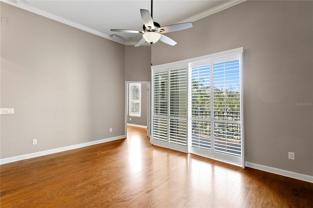 unfurnished room featuring crown molding, hardwood / wood-style floors, and ceiling fan