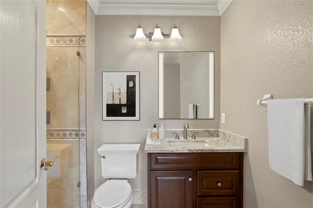 bathroom with ornamental molding, toilet, and a shower with door