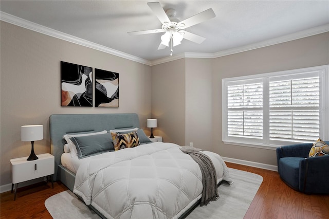 bedroom featuring crown molding, ceiling fan, and hardwood / wood-style floors