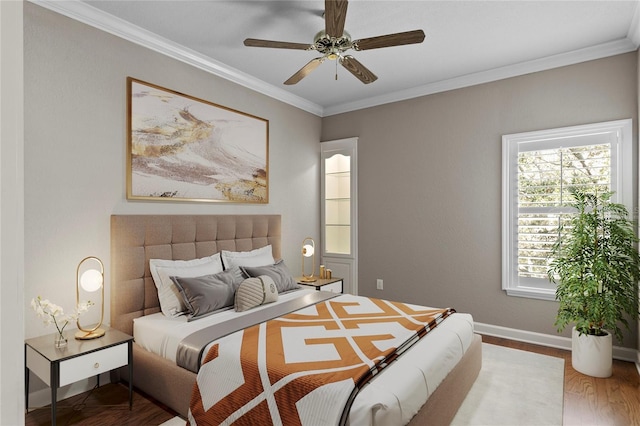 bedroom with crown molding, ceiling fan, and wood-type flooring