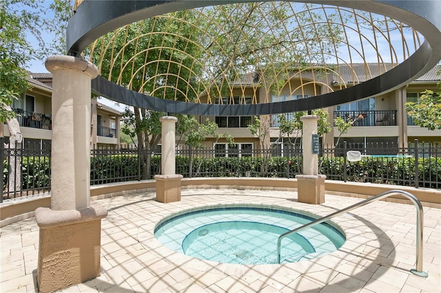 view of pool with a community hot tub