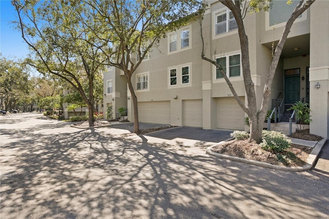 multi unit property featuring a garage