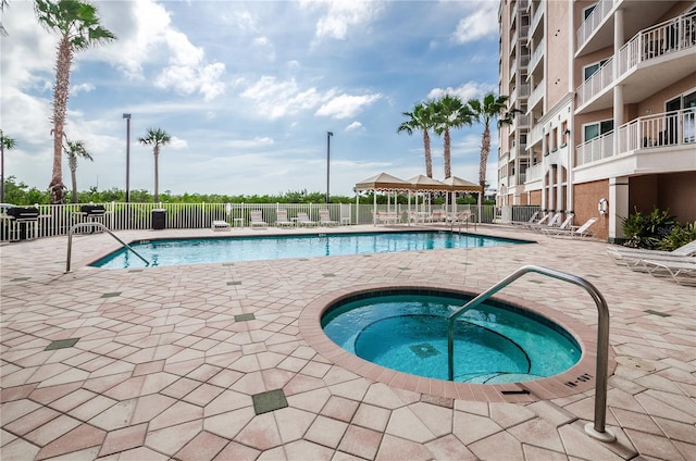 view of pool featuring a hot tub