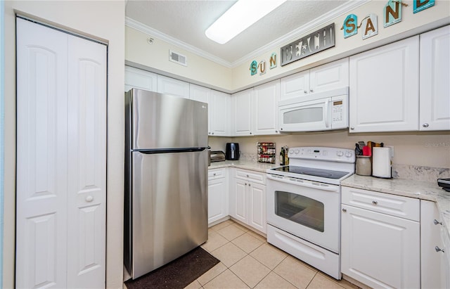 kitchen featuring white cabinetry, crown molding, light tile patterned flooring, and white appliances